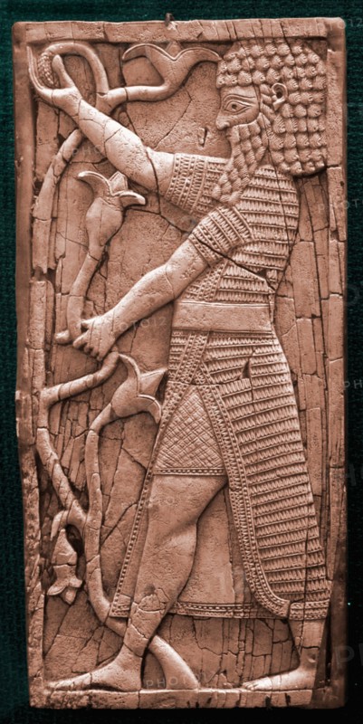 Fragment showing a warrior in ceremonial dress holding a lily