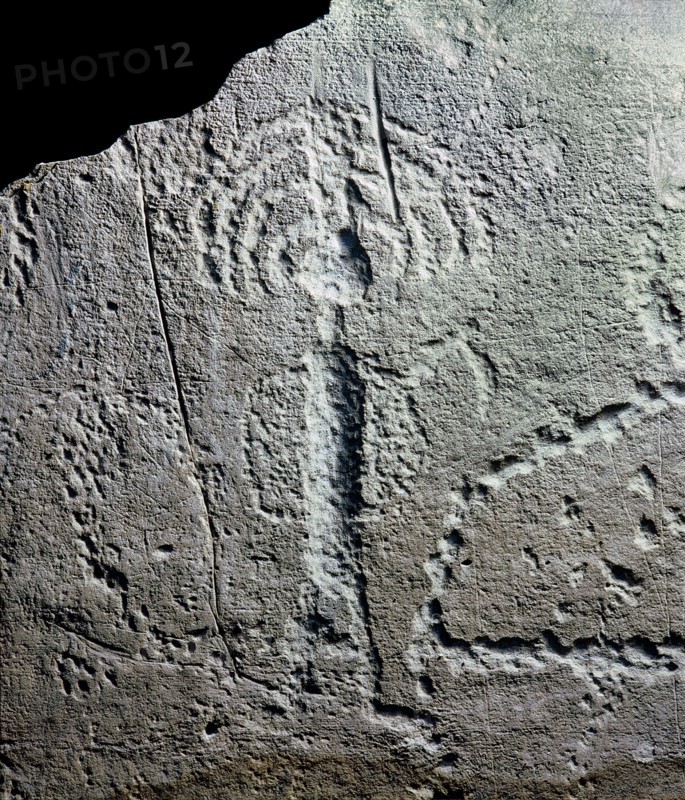 Rock engraving depicting a warrior with a feathered headdress