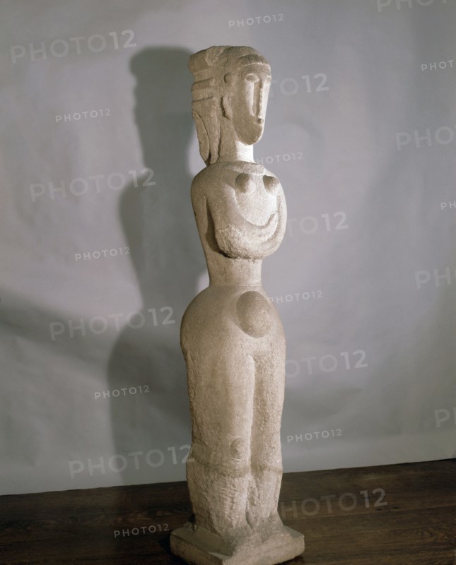 A full length statue of a woman by Modigliani