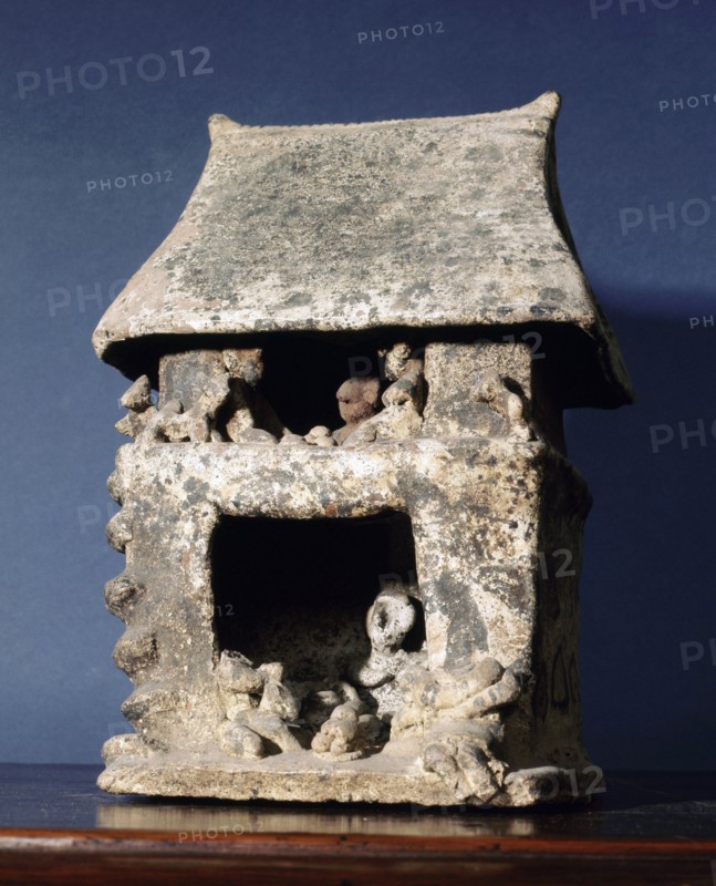 Miniature clay mortuary house associated with shamanistic rituals