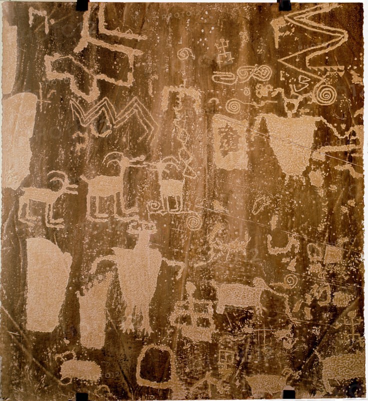 Petroglyphs depicting shamans and sheep