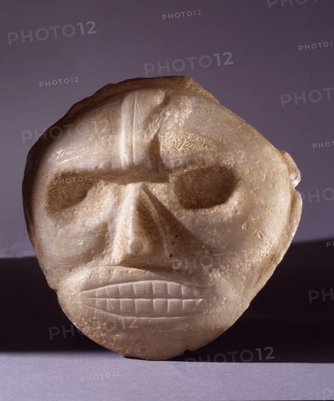Taino stone maskett thought to represent stylized portrait of a cacique or noble