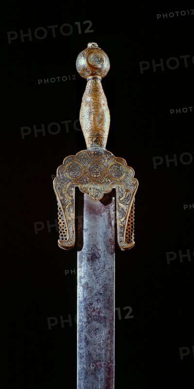 A very rare ceremonial iron sword with brass pommel