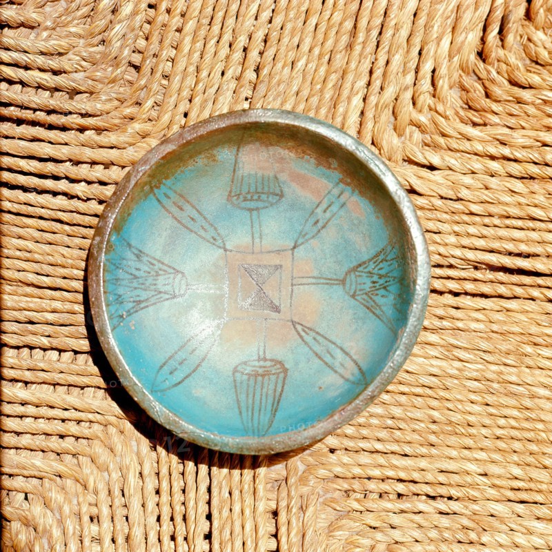 Bowl with faience interior incised with design including lotus buds