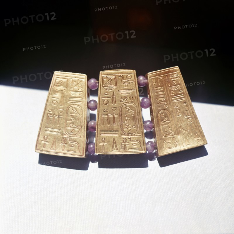 Fragment of Nubian jewellery, with gold panels incised with Egyptian hieroglyphs, including royal names