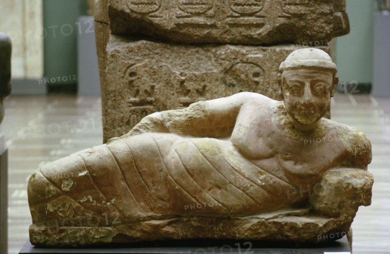 Statue of a reclining man found in a bath house at Meroe
