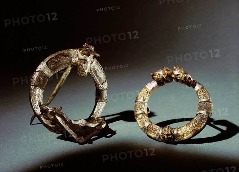 Two ring brooches