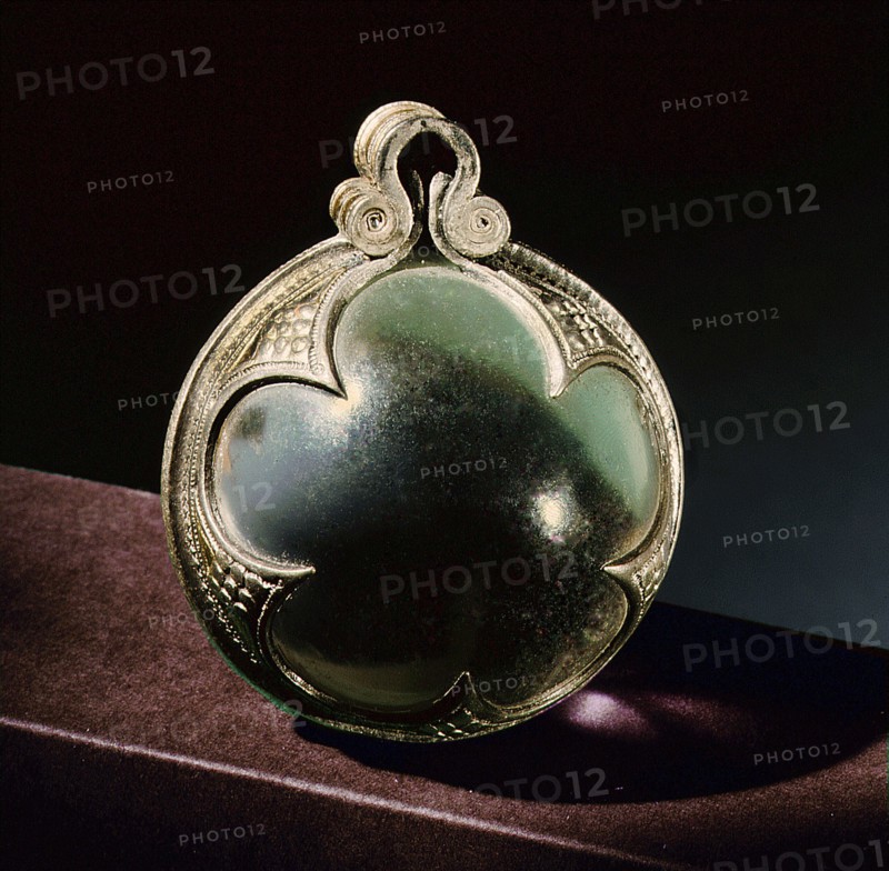 Silver mounted rock crystal sphere, a pendant from a necklace