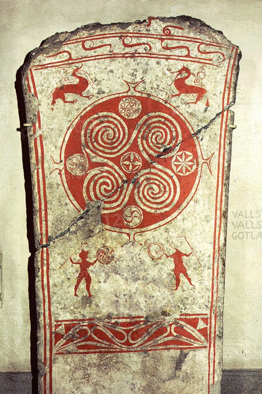 Memorial picture stone decorated with whorls symbolising the sunand vignettes from the hunt