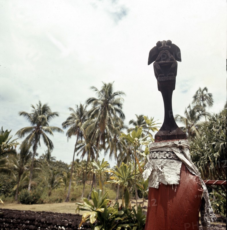 Figure of a god mounted on a pillar in the walled enclosure of the Marae Attahooroo, Tahiti