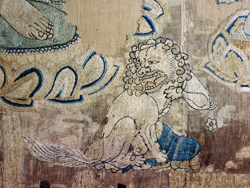 Detail of an embroidered silk banner of the Buddha Sakyamuni preaching on Vulture Peak