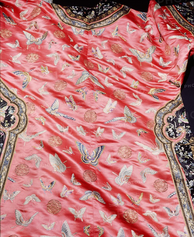 Detail of a dress embroidered with butterfly motifs