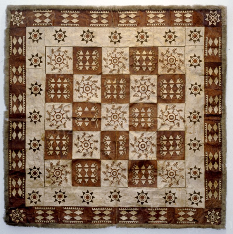 Decorated rug made of animal skin squares