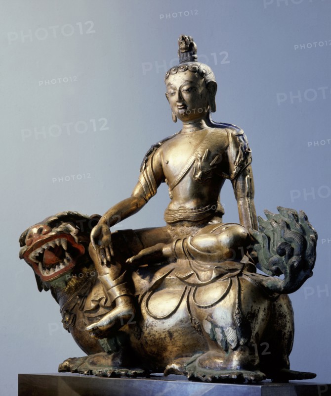 A statue of Simhanada, Voice of a Lion, sitting on the back of a roaring lion