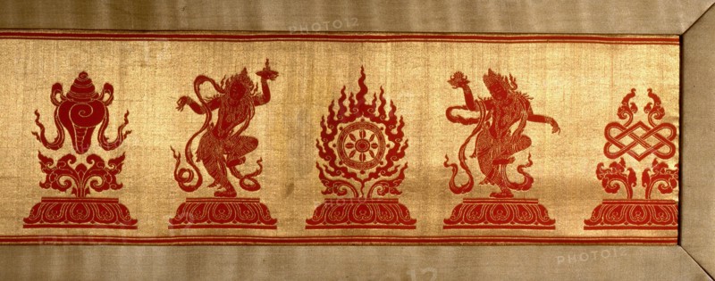 Sino Tibetan silk and gold brocade altar cloth depicting eight auspicious emblems interspersed by puja devis (offering goddesses) who offer gifts to the five Dhyani Buddhas, or Buddhas of meditation