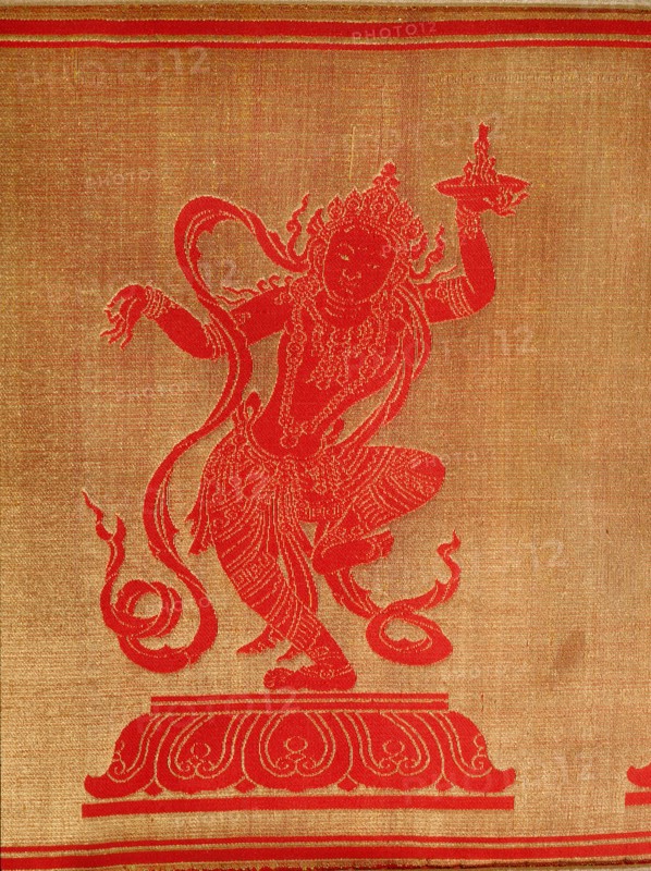 Sino Tibetan silk and gold brocade altar cloth depicting eight auspicious emblems interspersed by puja devis (offering goddesses) who offer gifts to the five Dhyani Buddhas, or Buddhas of meditation