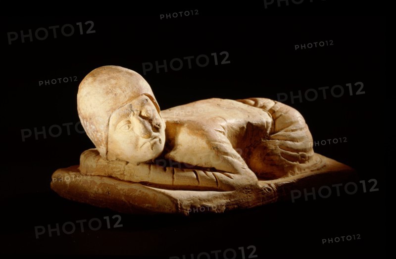 Tomb figure (miniature pillow) in the form of a kowtowing Persian trader