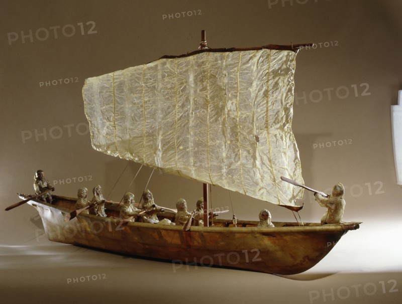 Model umiak with a helmsman and members of his family manning the oars