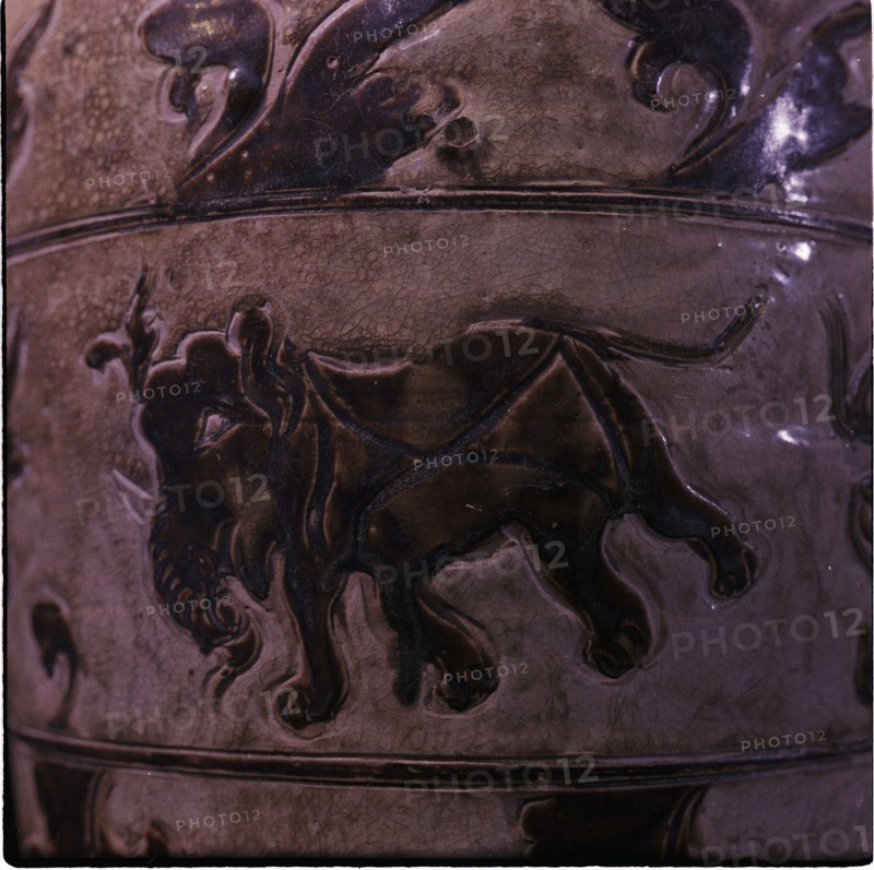 Detail of ornaments on a stoneware pot with an elephant theme