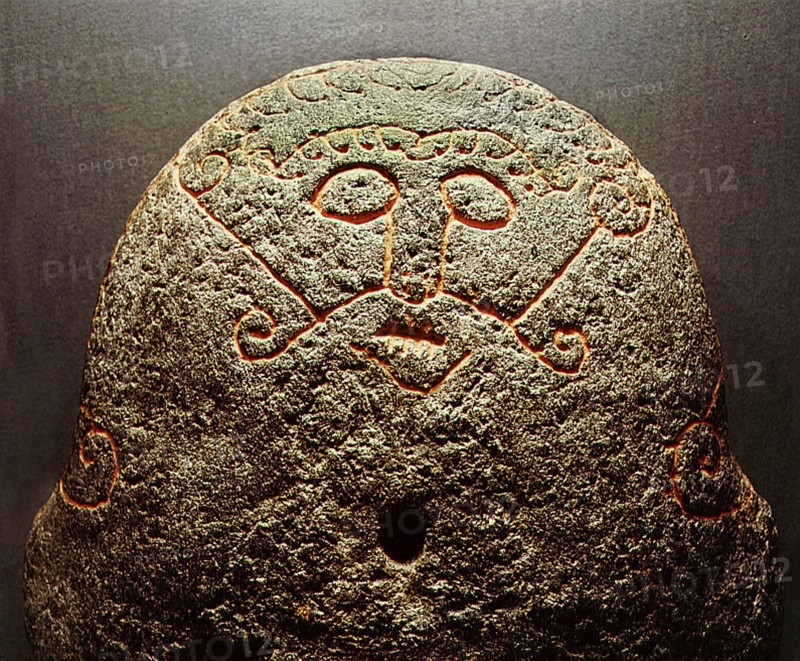 Detail of a forge stone incised with the face of the god Loki with lips sewn together