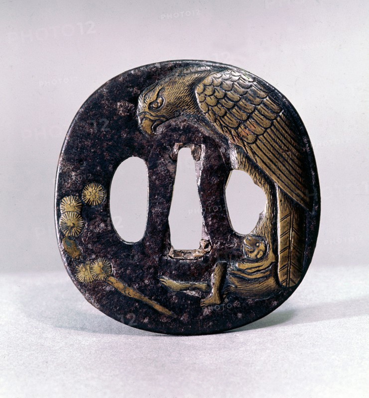 Tsuba (sword guard) engraved with an eagle grasping a monkey in its talons