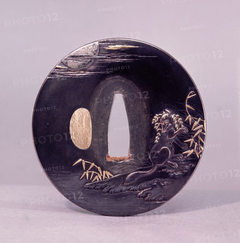 Tsuba (sword guard) decorated with a magic fox disguising itself as a woman