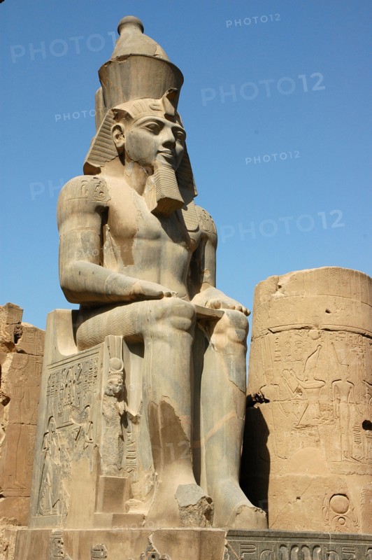 Seated figure of Rameses II wearing the double crown of Upper and Lower Egypt