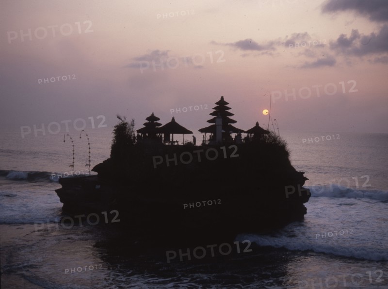 Tanah Lot, a small temple on a rocky outcrop cut off at high tide, is one of the most spectacular and popularof the island's thousands of temples