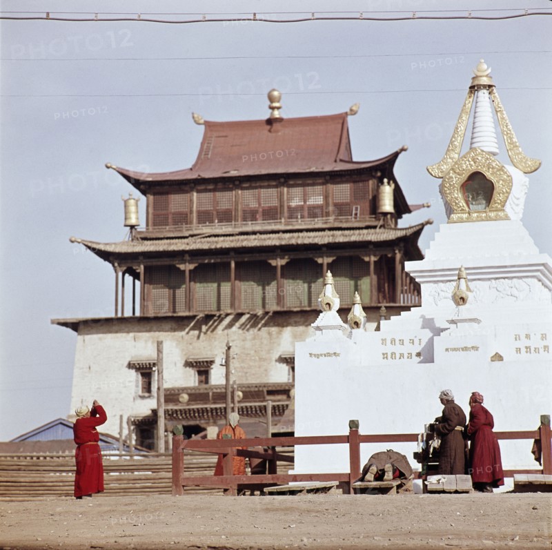 Mongolians praying at an open air shrine in the centre of Ulan Bator