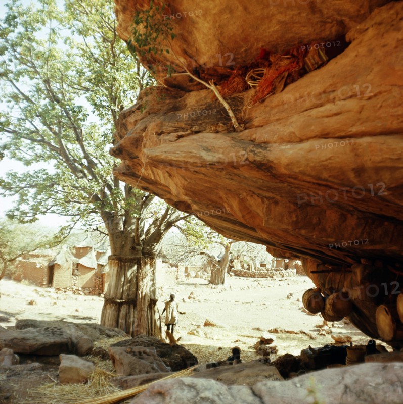Niches at the base of the high cliffs above the village are used to store sacred masks and drums