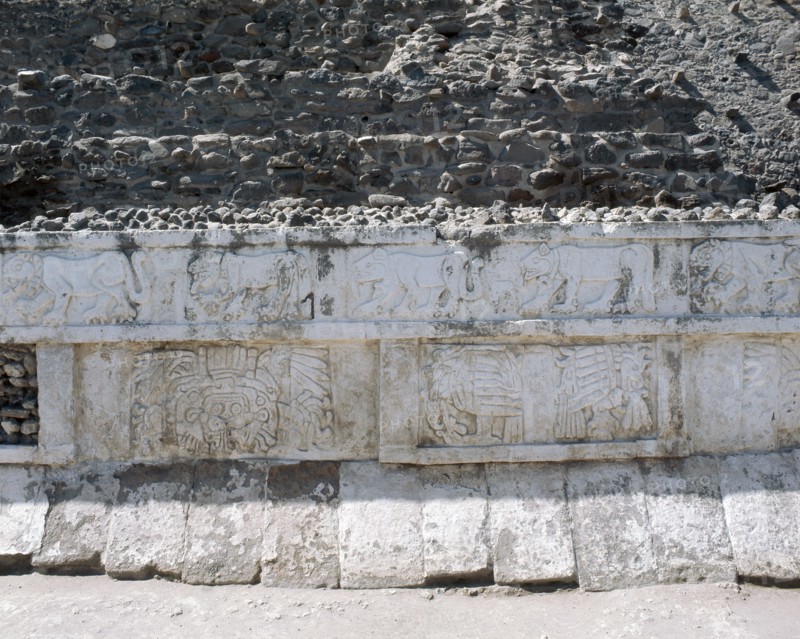 Bas relief friezes depicting jaguars and coyotes on the top and eagles devouring hearts on the bottom