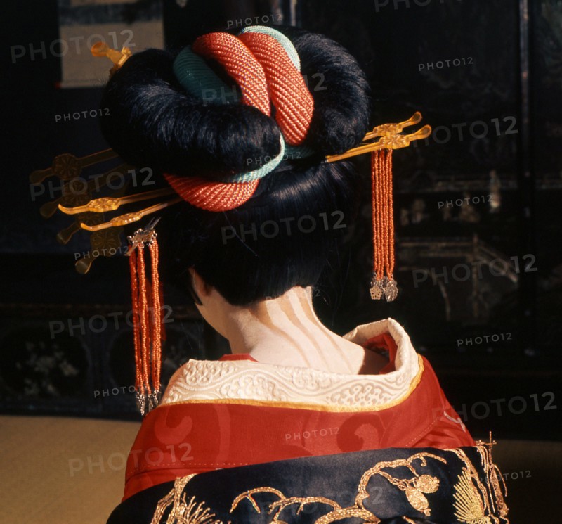 A geisha in traditional dress and make-up