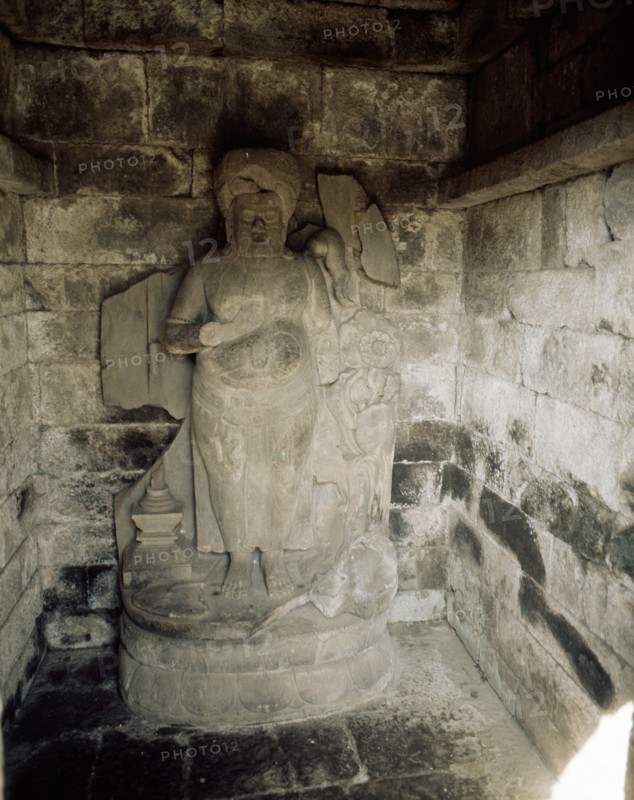 Statue in a niche from the complex of temples at Lara Jonggrang