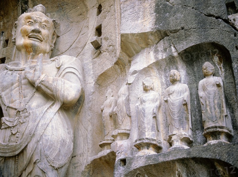 One of The Guardian kings of Buddhism, carved on the north wall of the Fengxian temple at the Longmen cave-temple complex
