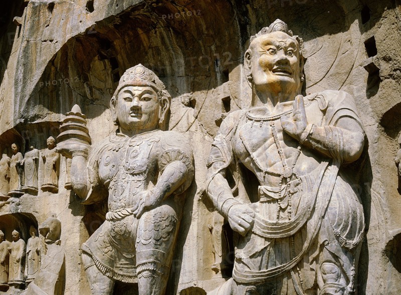 The Guardian kings of Buddhism carved on the north wall of the Fengxian temple at the Longmen cave-temple complex