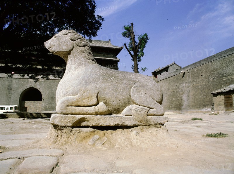 A statue of a kneeling horse near Xian city wall