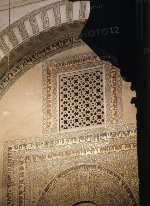The grille and calligraphy in mosaic above the doorway to the treasury in the Great Mosque at Cordoba   Spain