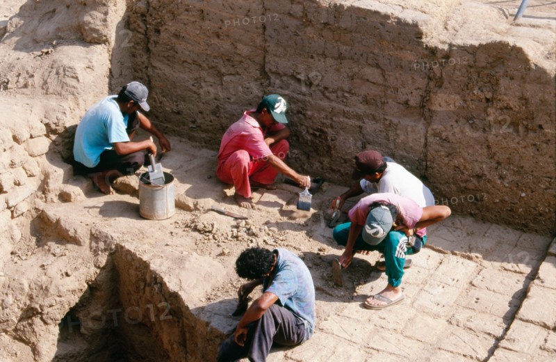 Archaeologists at work on the excavation of the temple-tomb pyramid at Sipan, Lambayeque Valley