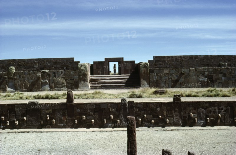 View across the "Semi-subterranean temple" to the monolithic doorway to the Kalasasaya enclosure, Tiahuanaco   Bolivia