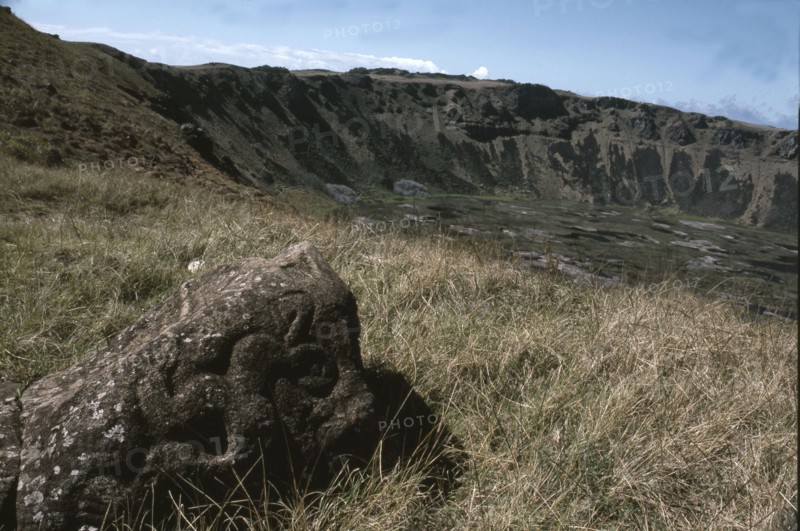 Bird-Man petroglyph by the edge of crater of Rano Kao volcano