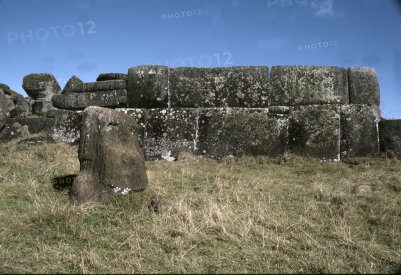 The so-called "Inca-style" masonry at Ahu Vinapu, with a half buried Moai head in the foreground