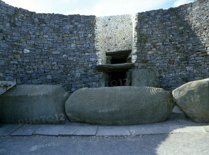 The incised entrance stone in front of the mouth of the passage to the burial chamber at Newgrange