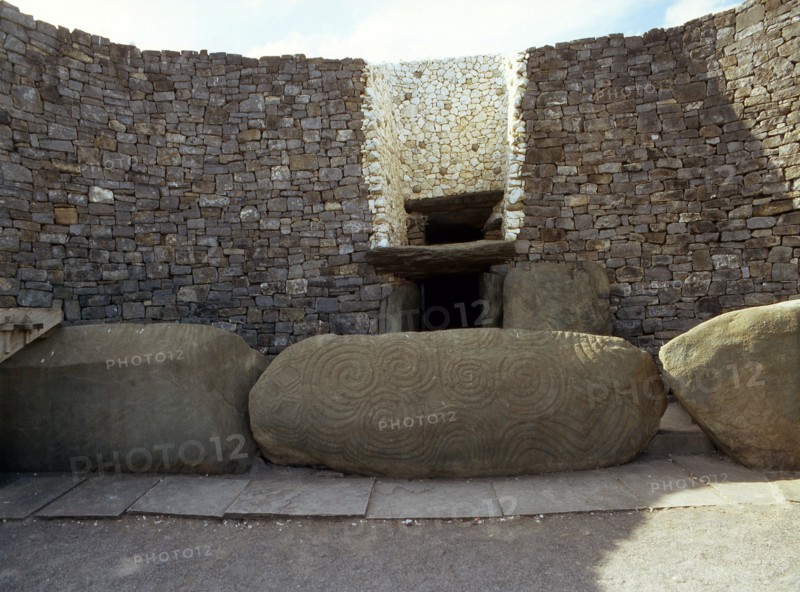 The incised entrance stone in front of the mouth of the passage to the burial chamber at Newgrange