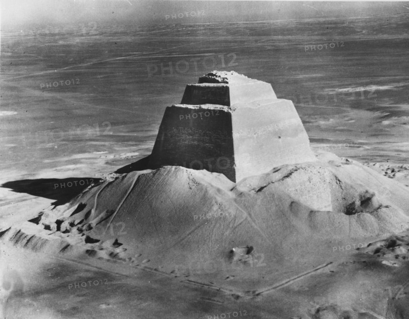 The pyramid of Meidum, surrounded by the debris of its collapsed outer covering, photographed in the 1920's