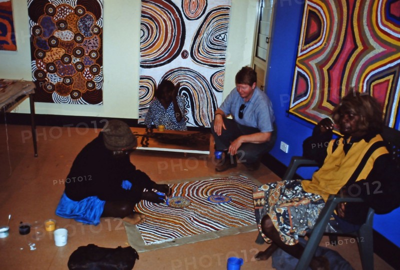 Balgo Community artist, the late Mati Mudgedell, working on a dot painting at the Warlayirti Culture Centre in the north-west desert region of Western Australia south of Halls Creek