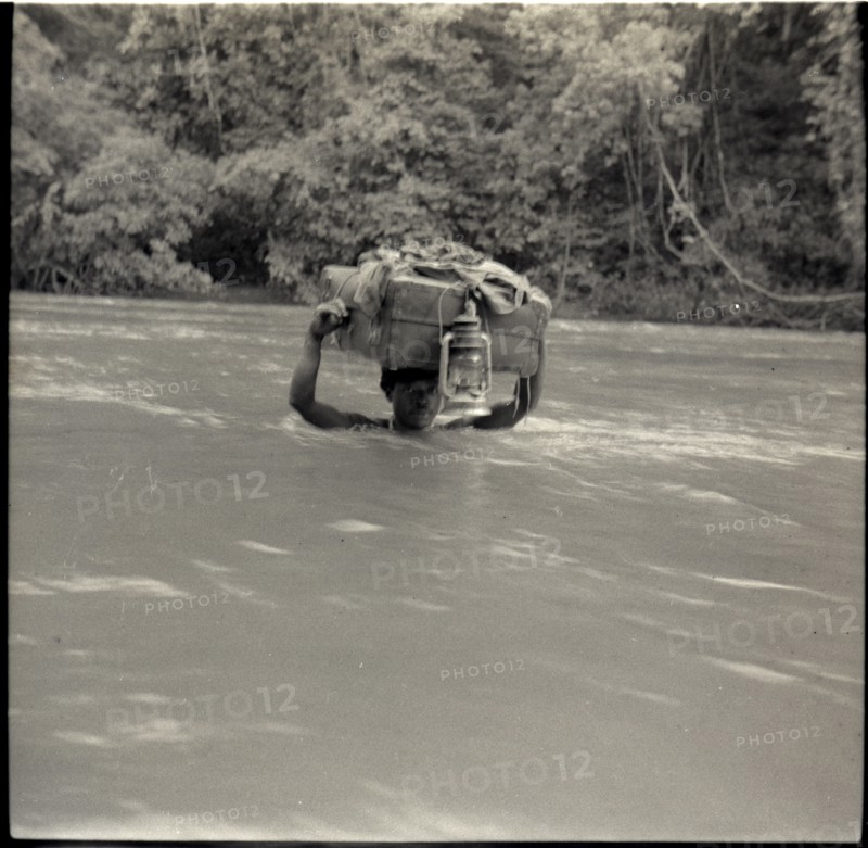 Boys crossing river