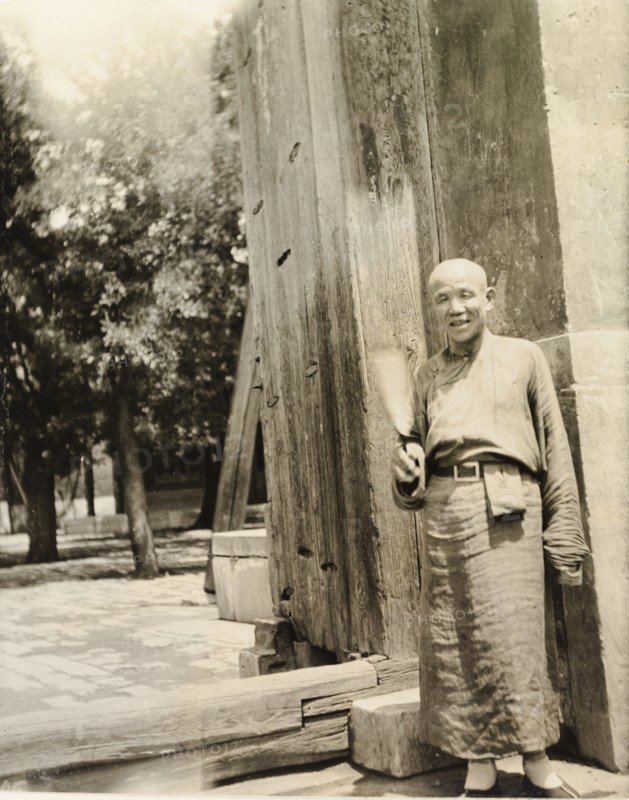 Lama priest at the doorway to a temple