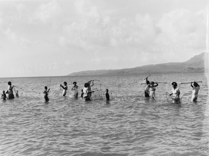 Women and children fishing in Fiji