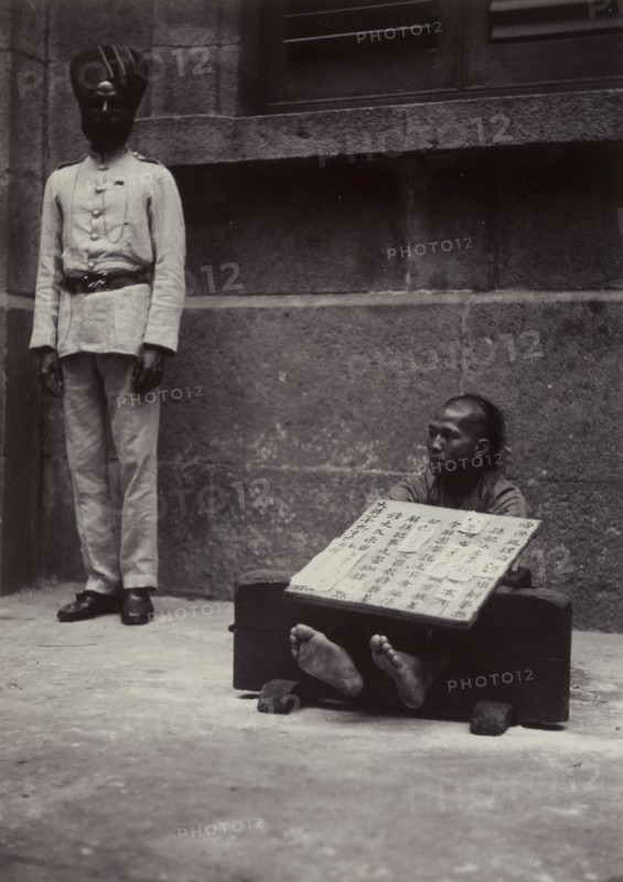 Petty criminal in the stocks, Hong Kong
