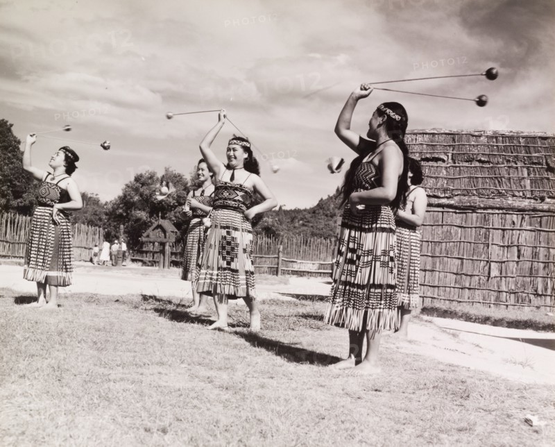 Maori women perform the 'double long poi'